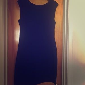 Black form fitting dress.